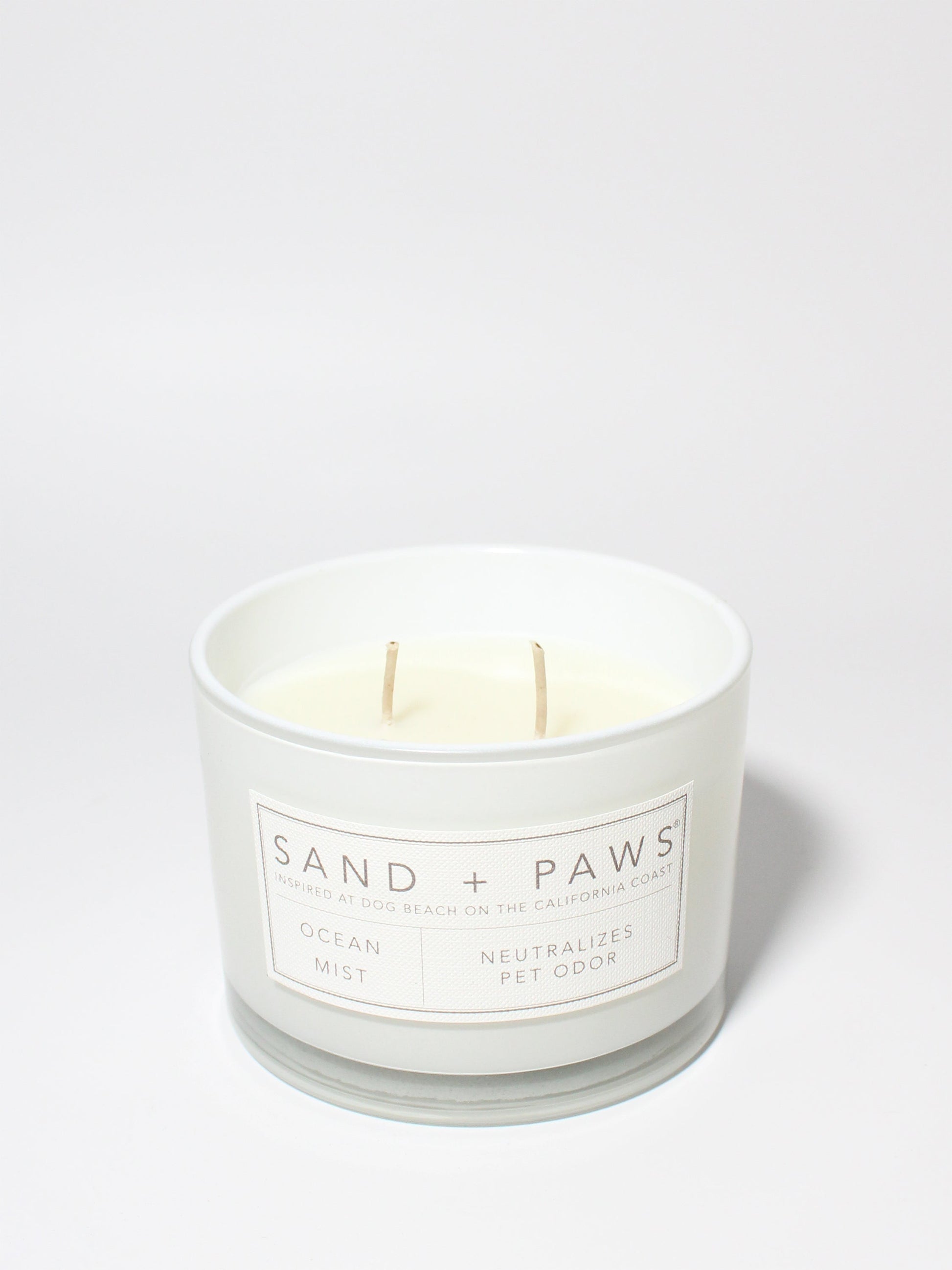 Sand + Paws Ocean Mist 12 oz scented candle White vessel with Carved Paw Print lid